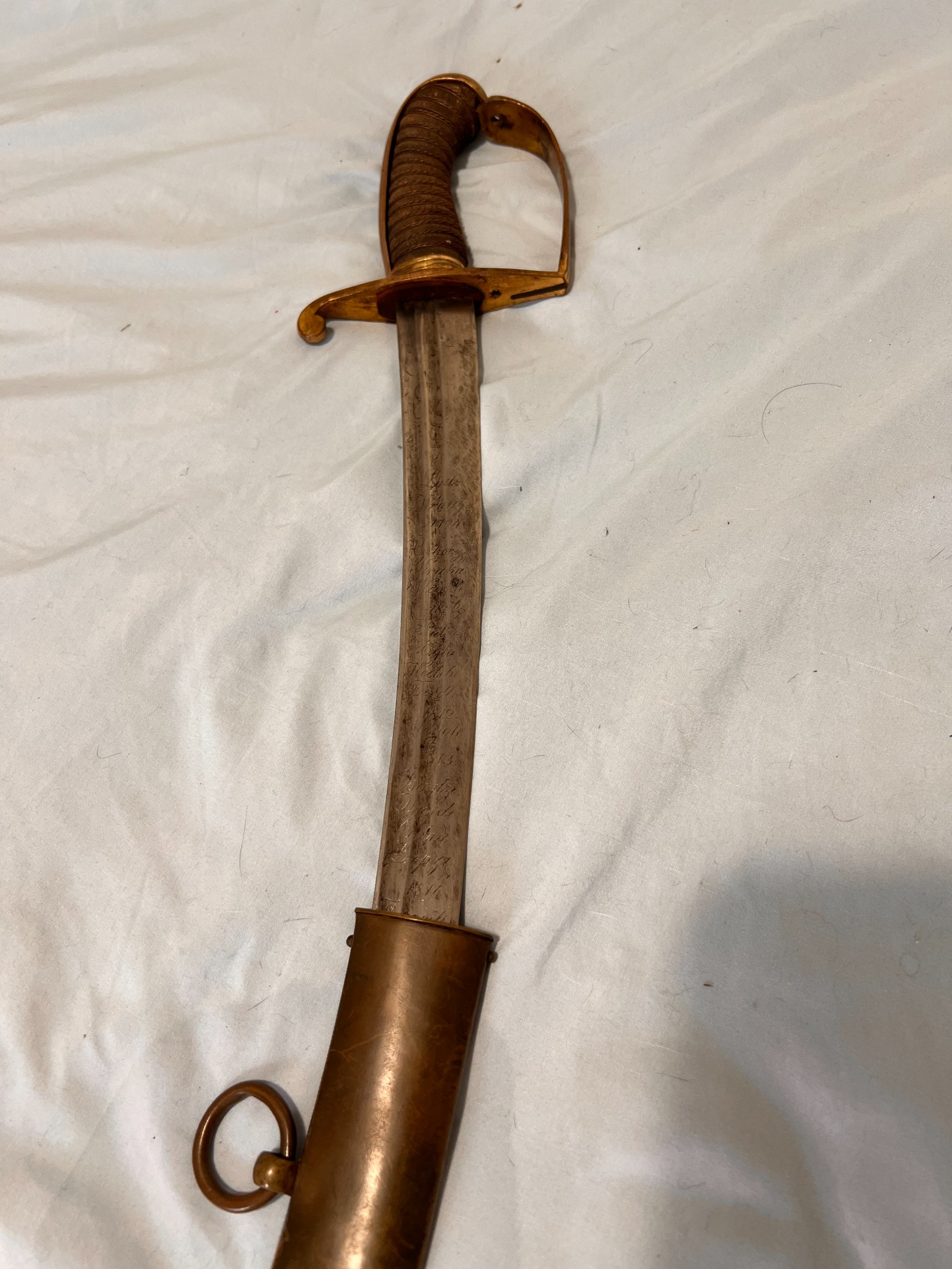 Close view of the saber grip, knucklebow and brass guard