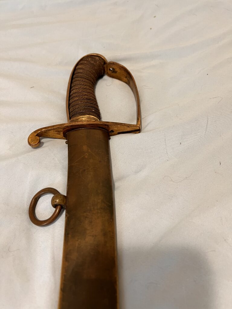 Detailed view of the saber hilt, grip, guard and pommel